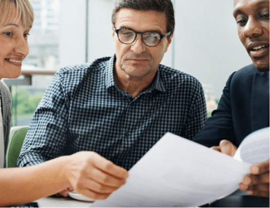 Buisiness men discussing the terms of a private mortgage with their lender.