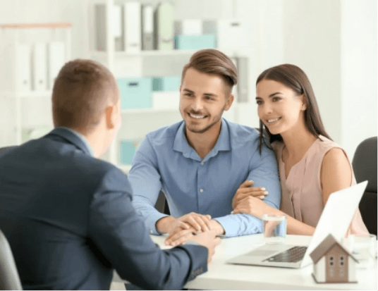 Young couple dicussing private loans with their lender