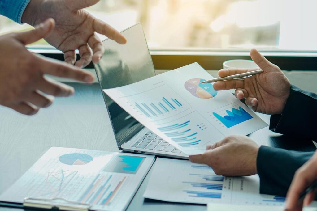 Business people discussing their recent financial reports.